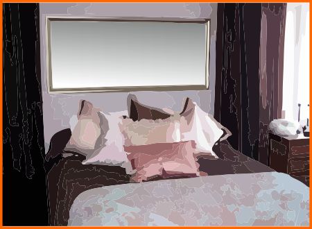 Rectangular mirror over bed